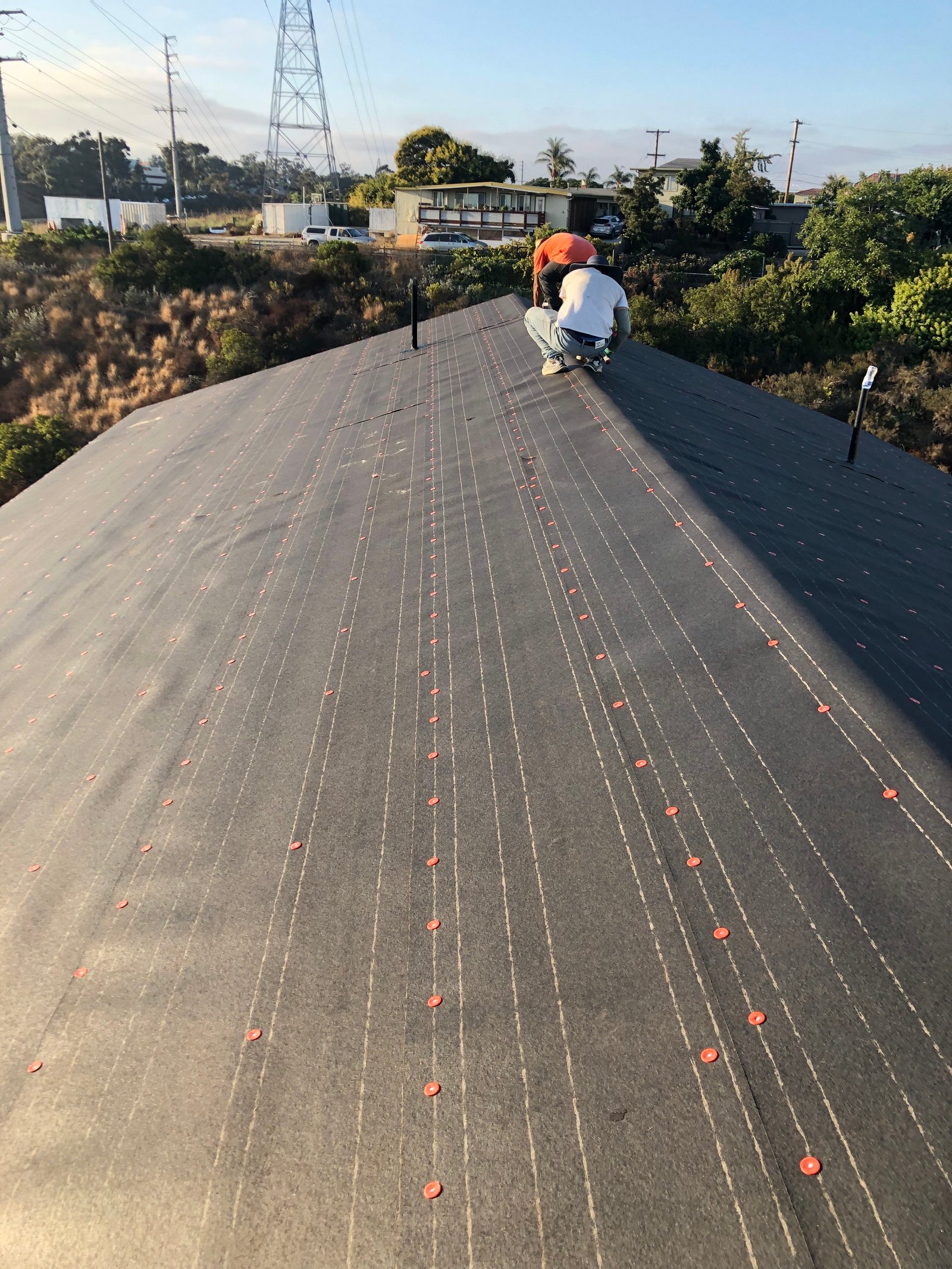 Roof deck prepared with underlayment during addition construction